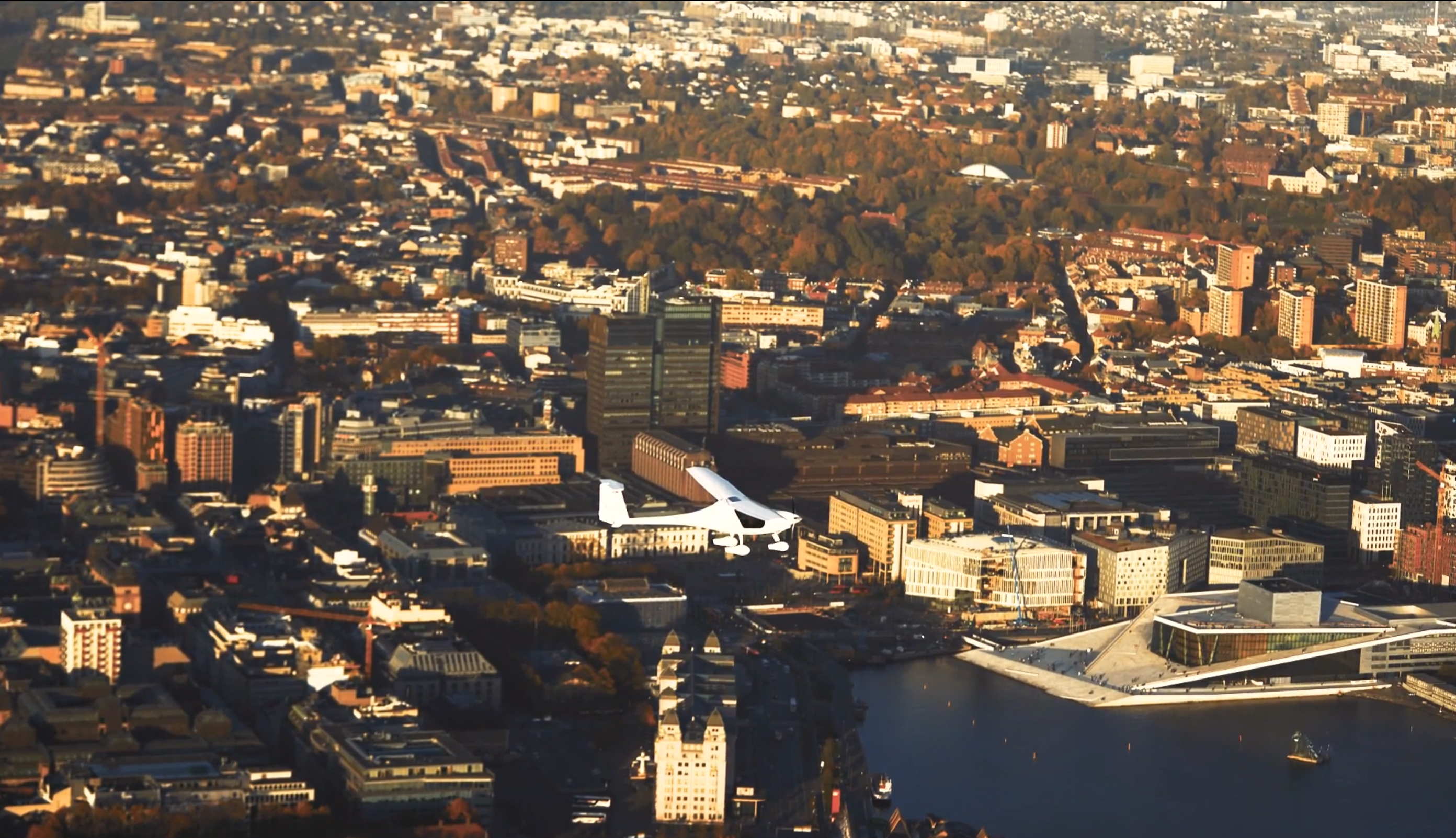 helicopter in flight over a city landscape